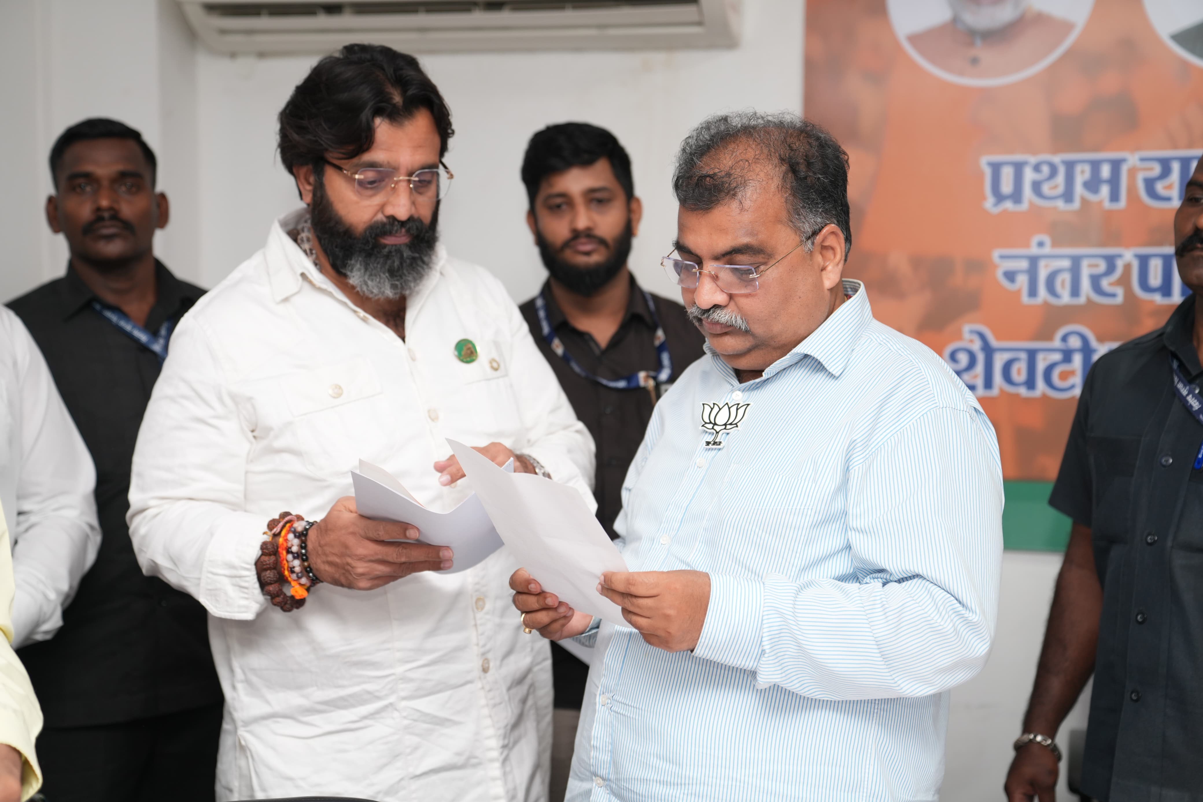 Formal indoor meeting with leaders reviewing documents together