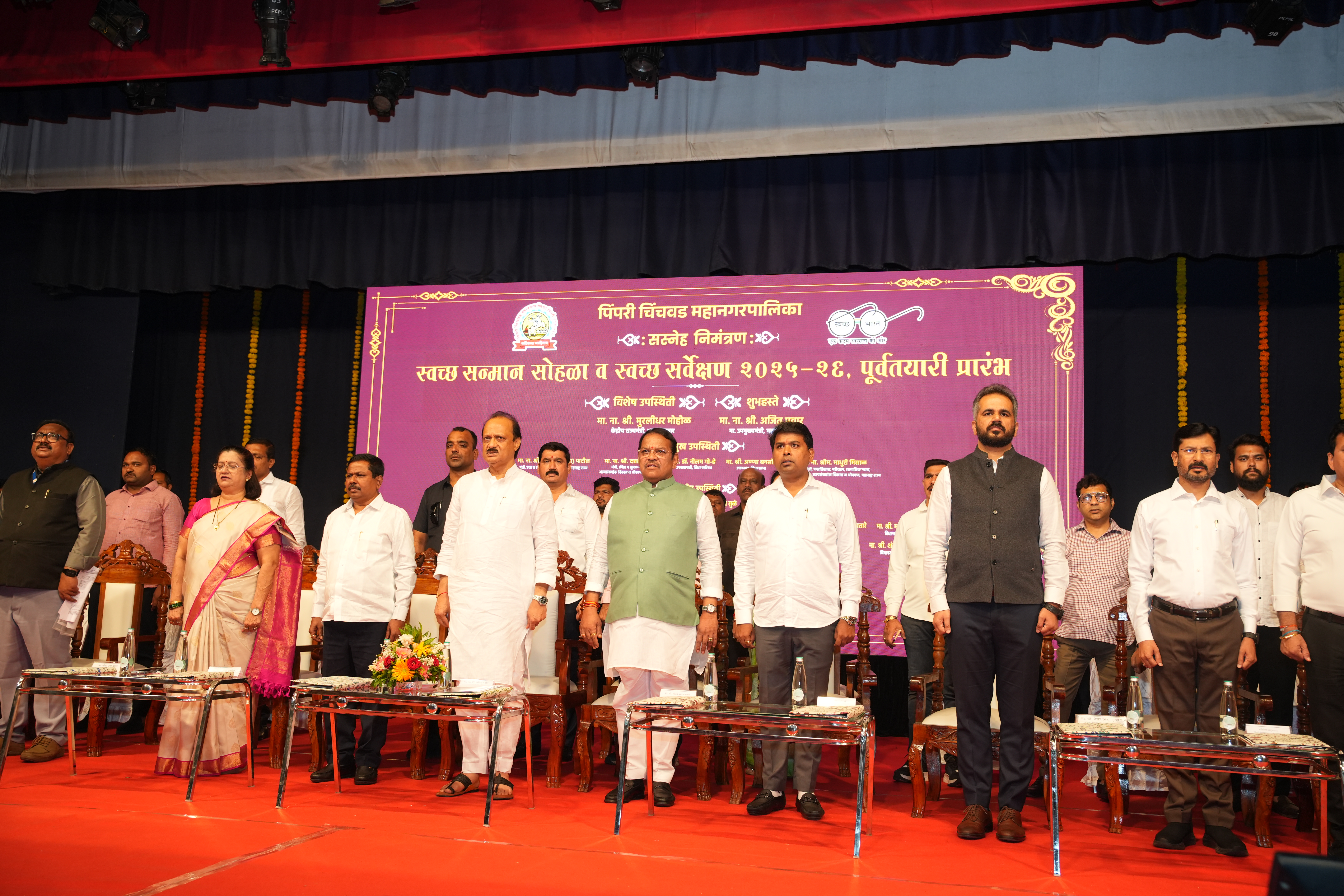 Wide conference room gathering in a polished formal meeting hall